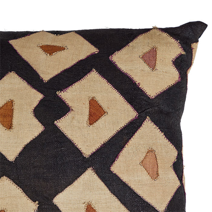 (CORNER DETAIL) African Kuba Pillow. 28 x 28. Hand-woven African Kuba throw pillow with dyed raffia and fused backing. Black linen back, invisible zipper closure, filled with feather and down.