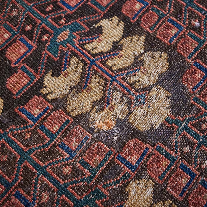 (REPAIRS) Antique Hamadan Rug. Early 20th C. Hamadan knotted rug made in NW Persia. Attractive colors with some repairs as shown. 77" x 45"