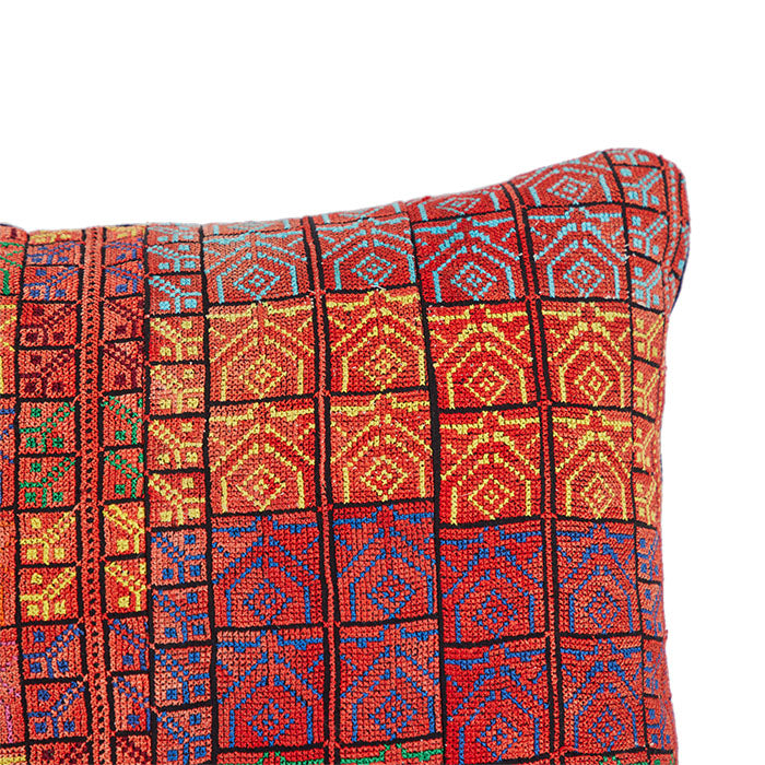 (CORNER DETAIL) Levantine Needlepoint Embroidery Throw Pillow. Cotton floss petit point embroidery on cotton with black linen back. Invisible zipper closure and feather and down fill. 14" x 21"