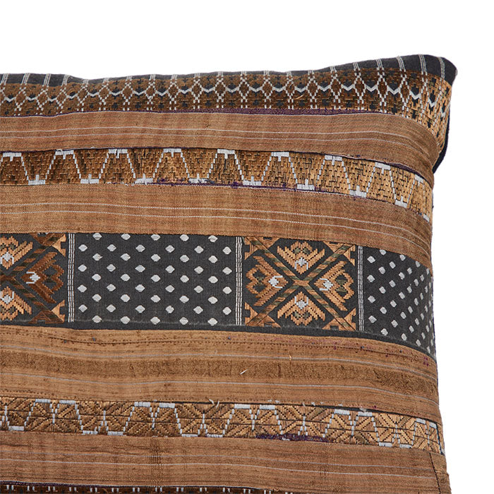 (CORNER DETAIL) Chinese Hill Tribe Pillow. Chinese Hill Tribe production. Silk skirt trim ribbons sewn together. Black linen back. Invisible zipper closure and feather and down fill. 12" x 53"