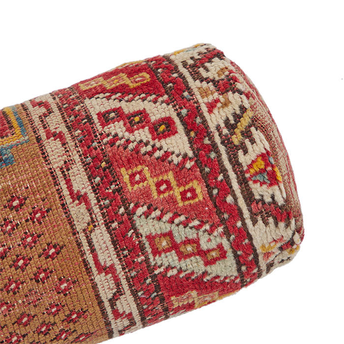 (DORNER VIEW) Turkish Rug Bolster Pillow II. Vintage Turkish village rug reconfigured into a bolster pillow. Zipper closure and feather and down fill. Two available. Priced and listed individually. 6" x 18"