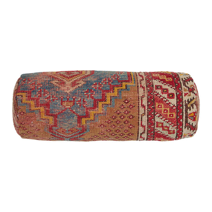 Turkish Rug Bolster Pillow II. Vintage Turkish village rug reconfigured into a bolster pillow. Zipper closure and feather and down fill. Two available. Priced and listed individually. 6" x 18"