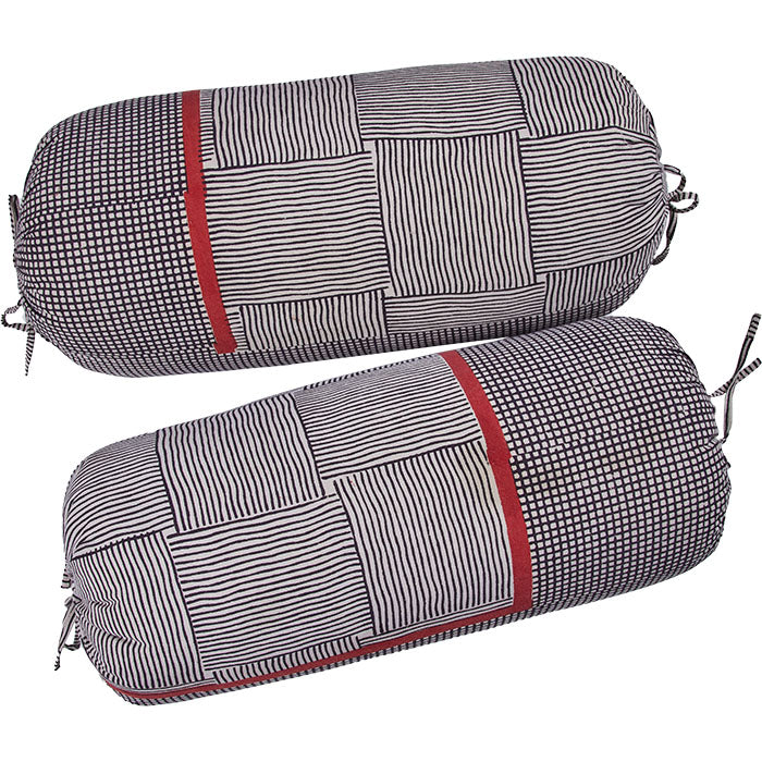 Indian Block Printed Gopal Bolster Pillows. Hand block printed cotton. Large round bolsters. Tie closures. Feather and down fill. Two available.