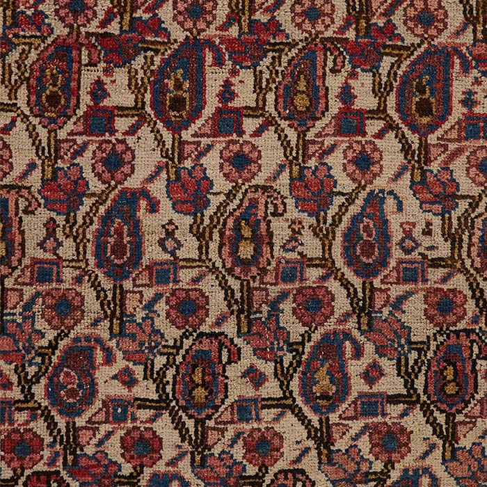 (DETAIL PATTERN AND FABRIC) Antique Hamadan Rug, an early 20th century rug from Iran featuring an all-over Boteh (Paisley) design. This rug is in good condition with an even pile and minor damage on the right edge. It measures 62x45.