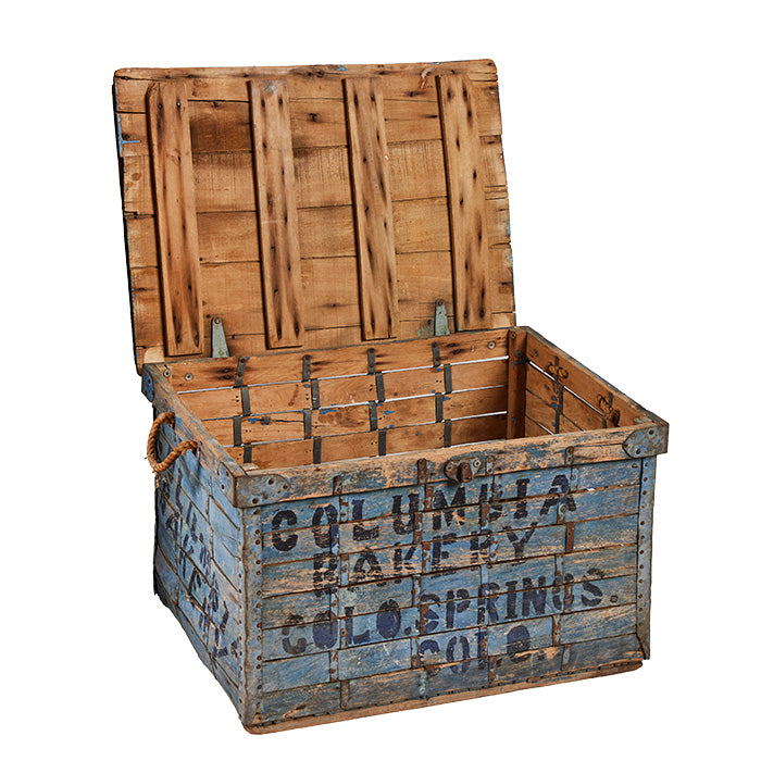 (SIDE OPEN LID) Vintage Bread Delivery Crate - Well preserved, clean, worn, and used old wooden box with original blue paint visible rust and ageing stamped with block letters in dark blue "Columbia Bakery Colo. Springs Col." Rope handles. Lid opens on hinges to clean wood inside. 17" H x 27" W x 20" D