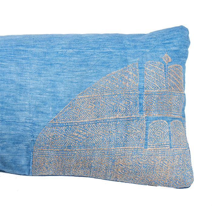 (CORNER DETAIL) African Embroidery Indigo Pillow II. Blue and grey. Made from a vintage Hausa Chief’s Robe, known as a Boubou. Hausa is the largest tribal group in Nigeria. Floss hand embroidery over indigo cotton. Blue linen back, invisible zipper closure, feather and down fill. 12" x 31"