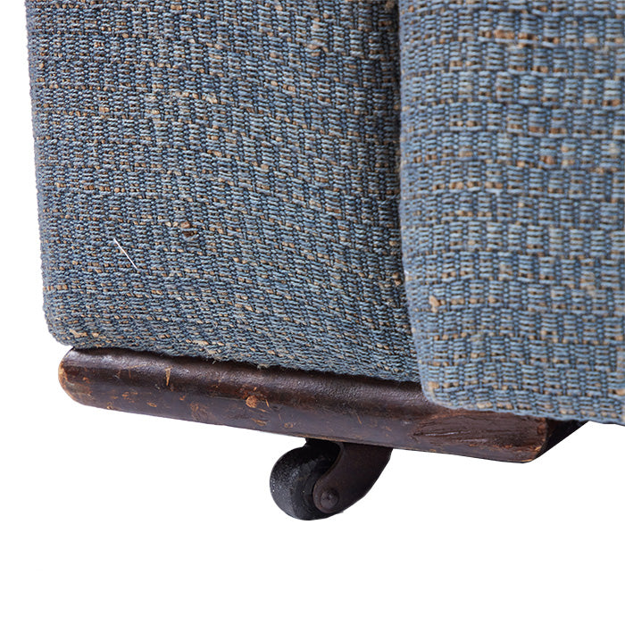 (WHEEL DETAIL) Art Deco Love Seat with French upholstery fabric in Eye Blue. 1930s design on wooden wheels.