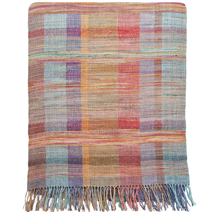 Bedcover by Neeru Kumar, Handwoven Designer Textiles from India. Exclusive to Pat McGann. Rainbow plaid linen and raw silk. 115” H x 88” W. Sizes vary slightly.