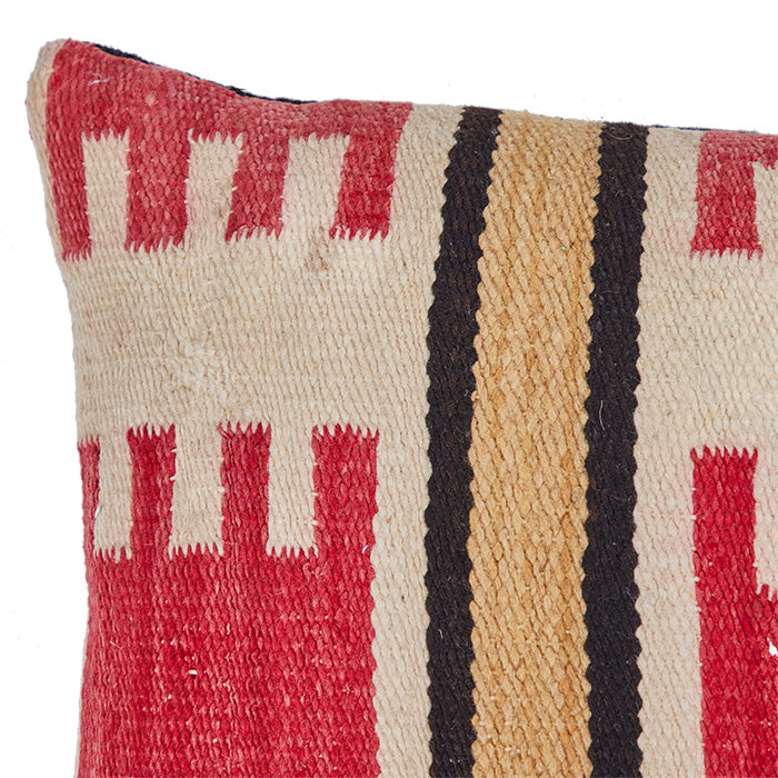(CORNER DETAIL) Small rug reconfigured into a pillow from the mid 20th century. Black linen back, invisible zipper closure, feather and down fill. Measures 15" x 26"