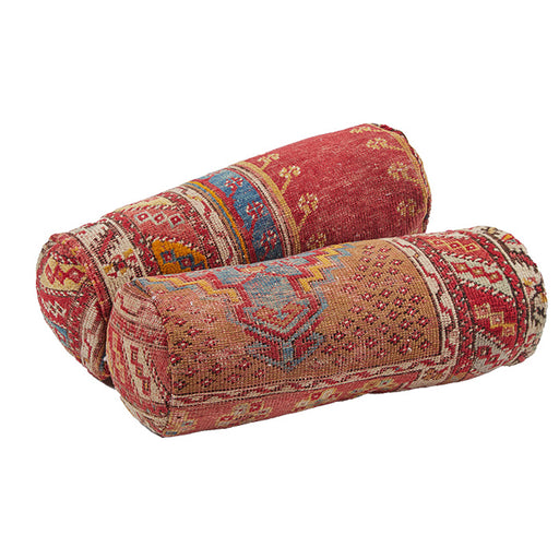 BOLSTER PAIR) Turkish Rug Bolster Pillow II. Vintage Turkish village rug reconfigured into a bolster pillow.  Zipper closure and feather and down fill. Two available.  Priced and listed individually. 6" x 18"