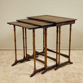 (DETAIL DISPLAY) Chinoiserie Set of 3 Nesting Tables.  Three antique nesting tables with faux bamboo legs and painted details on tops. Sturdy with age appropriated distressed paint. Antique Chinoiserie furniture. 30" H x 28" W x 18" D 