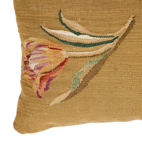 (CORNER DETAIL) This 18th century European tapestry fragment pillow features assorted blossoms on a muddy gold background. The natural linen back and invisible zipper closure are complemented by a feather and down fill. Dimensions are 10" x 19"