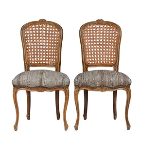 Pair of Antique French Chairs. Cane backs and upholstered with vintage hand embroidered wool fabric. 38" H x 20.5" W x 19" D.
