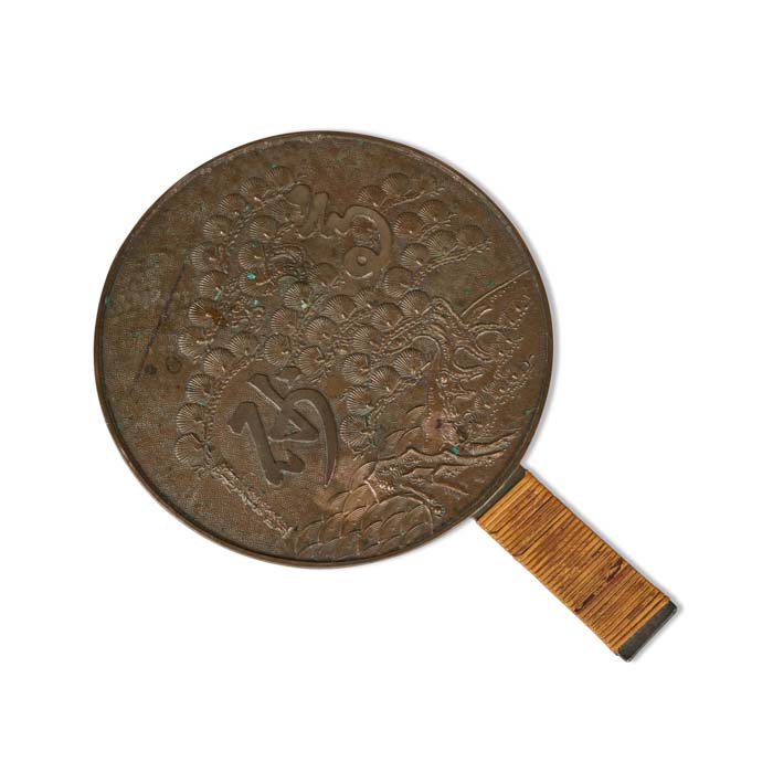 Antique Japanese Kagami Hand Mirror. Late 19th C. Artist signed repousse details on bronze.  Mirror side was highly polished for reflection.  Vintage home décor accessory. Original rattan wrapped handle. 11.5" H x 8" dia.