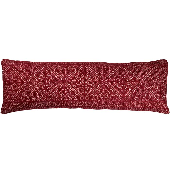 Bolster pillow made from antique Moroccan textile from the city of Fez. Intricate all-over silk floss on linen embroidery produces a durable fabric. The design is based on centuries old Mehindi (henna hand tattoo) designs. Natural linen back, invisible zipper closure, feather and down fill. 13" x 42"