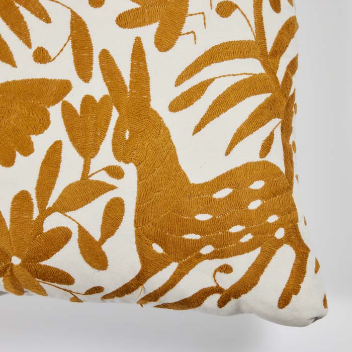 (DETAIL) Mexican Otomi Embroidery Pillow. Mexican Otomi embroidery fabric textile pillow. Gold colored floss thread on white cotton. Natural linen back, feather and down fill with invisible zipper closure. 18" x 18"