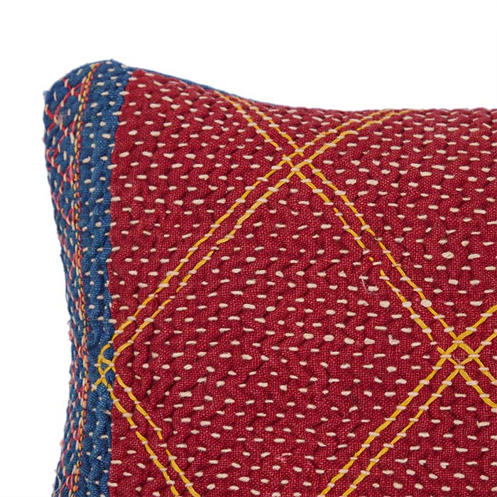 (LEFT TOP CORNER DETAIL) Quilted Banjara Bag Pillow VII. All over hand quilting. Vintage storage bag reconfigured into a pillow. Handmade in Gujarat State in India. Blue linen back. Invisible zipper closure, feather and down fill. 11" x 14"